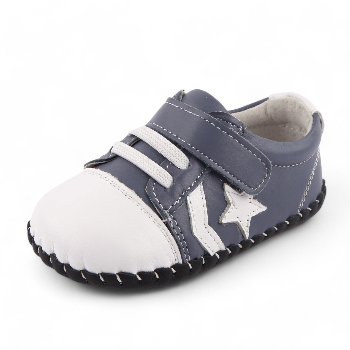 Kids shoes with star design, Velcro fastening, and white toe cap made with genuine soft leather