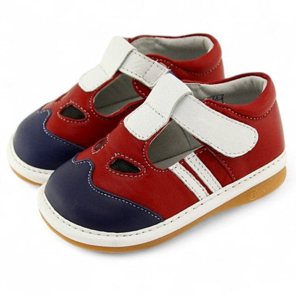 Red, white, and navy blue Soft Leather Pathfinder kids' sandals with white double Velcro straps