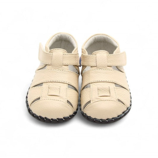 Soft cream-colored baby shoes with a flexible sole for toddlers