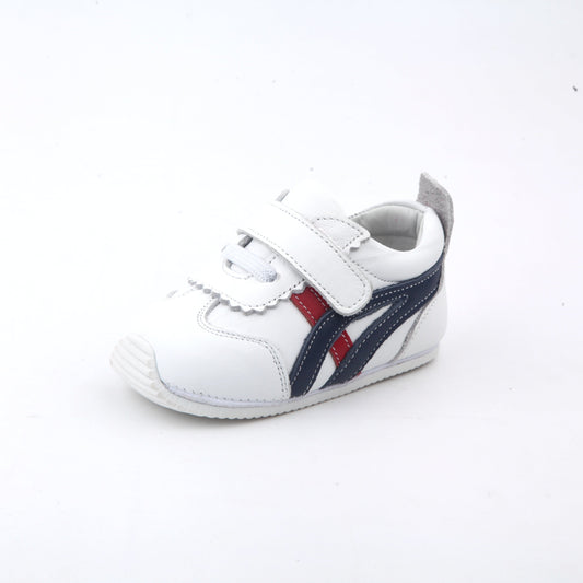 Tiny Treads Kids’ Sneakers in white. baby athletic kids shoes with blue and red stripe design and adjustable velcro