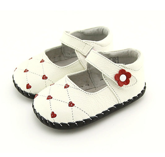 adorable pink or white baby shoes feature delightful flower adornments