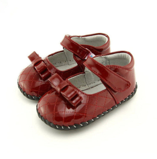 Dolly Dappers Girls Mary Janes. Adorable red patent kids leather shoes for little girls. Bow detail, soft sole, and adjustable strap. Healthy steps for first walkers.