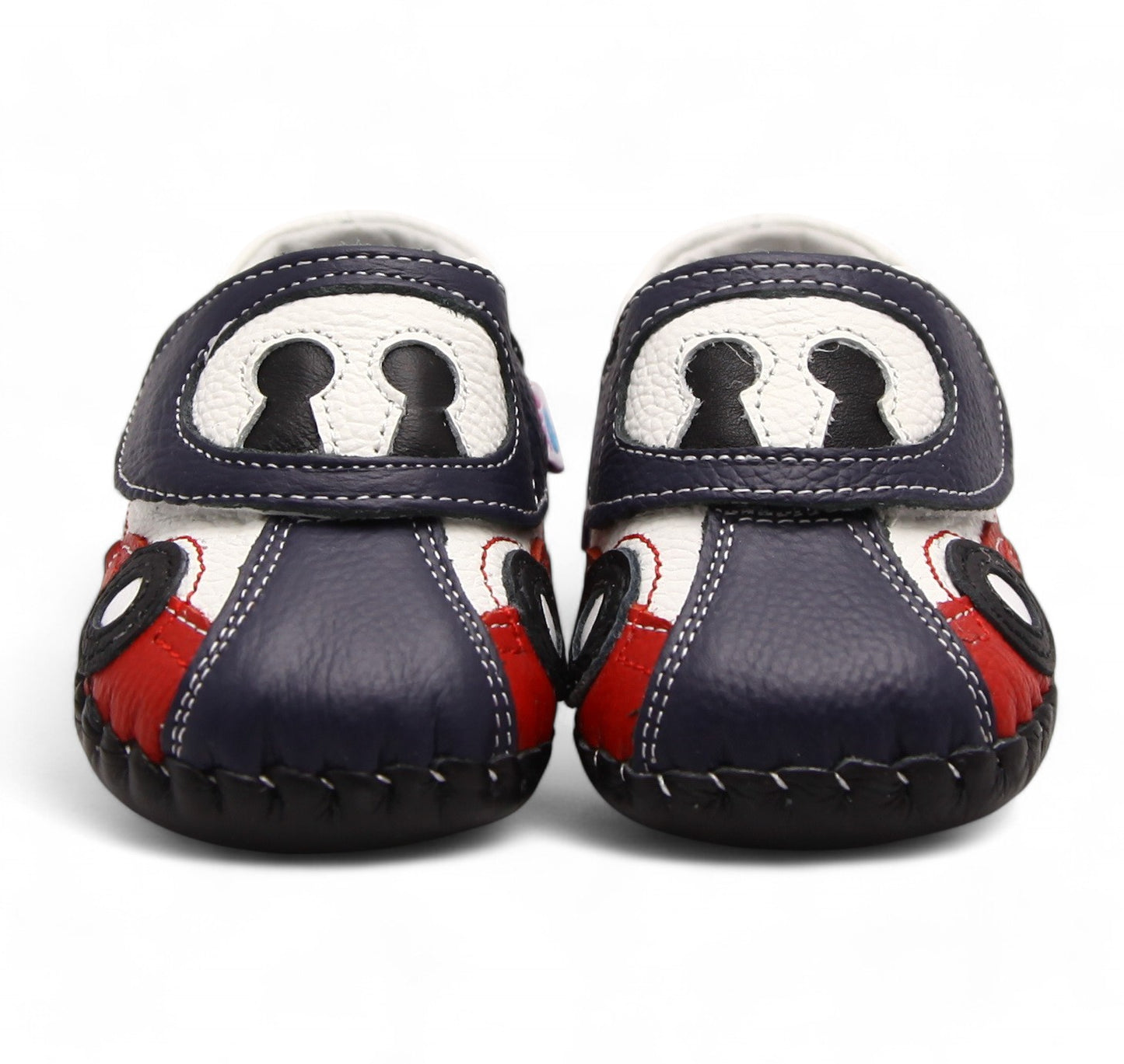 First walker leather kids shoes with soft sole. Navy blue, white, and red baby shoes with a cartoon car design on the toes