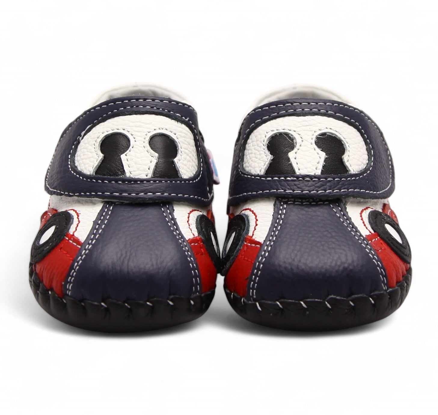 First walker leather kids shoes with soft sole. Navy blue, white, and red baby shoes with a cartoon car design on the toes