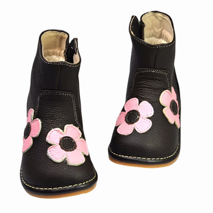 Fluffy-lined kids' boots with removable squeakers and added playful charm with daisy details. The perfect kids' footwear for adding joy to any toddler's outfit.
