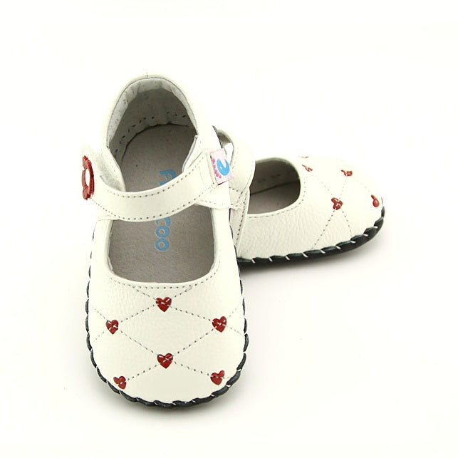 Heart Hoppers Kids’ Shoes with cute pink hearts and Velcro. Gentle interior and a flexible sole made from premium leather