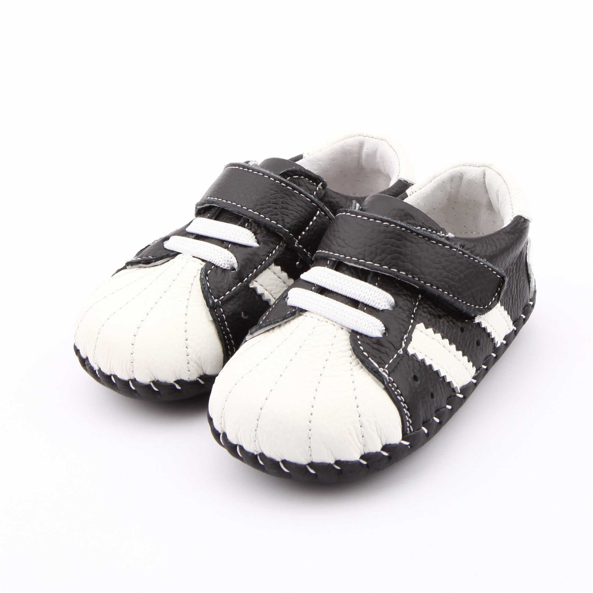 Hopscotch Heroes Retro Kids’ Sneakers with Velcro, Two-Tone Style. Capture that authentic vintage cool look with these stylish, two-tone kid's sneakers. Hopscotch Heroes are stylish, comfortable, and perfect for everyday play.