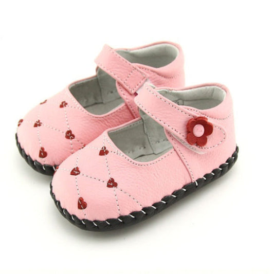Pink Heart Hoppers Kids’ Shoes Cute Girls’ Pumps. Sweetheart kids' shoes for girls. Heart Hoppers feature delightful flower adornments, complemented by delicate red heart accents for toddlers & first walkers.