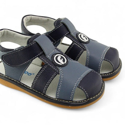 Genuine leather kids' sandals with fun, removable squeakers. Open design for cool comfort, with playful, removable squeakers that your toddler will love!