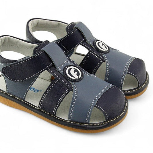 Genuine leather kids' sandals with fun, removable squeakers. Open design for cool comfort, with playful, removable squeakers that your toddler will love!