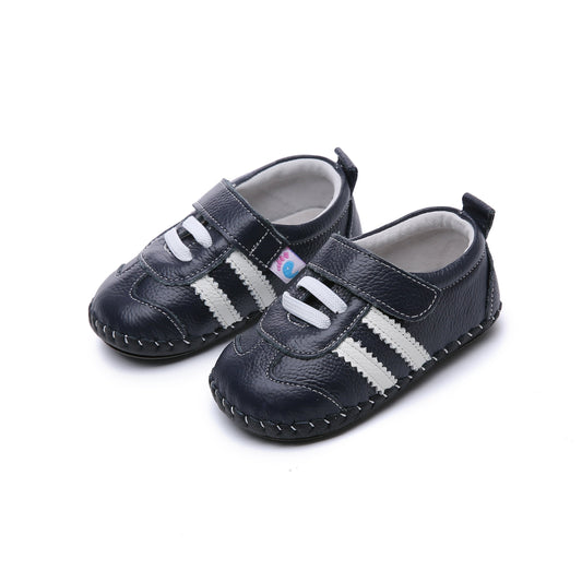 Tiny Titans First Walker Kids’ Shoes Soft Sole Sneakers. Support your toddler's first steps with Tiny Titans' first walker kids' sneakers. Soft leather, comfortable & stylish. Perfect baby shoes for growing feet!
