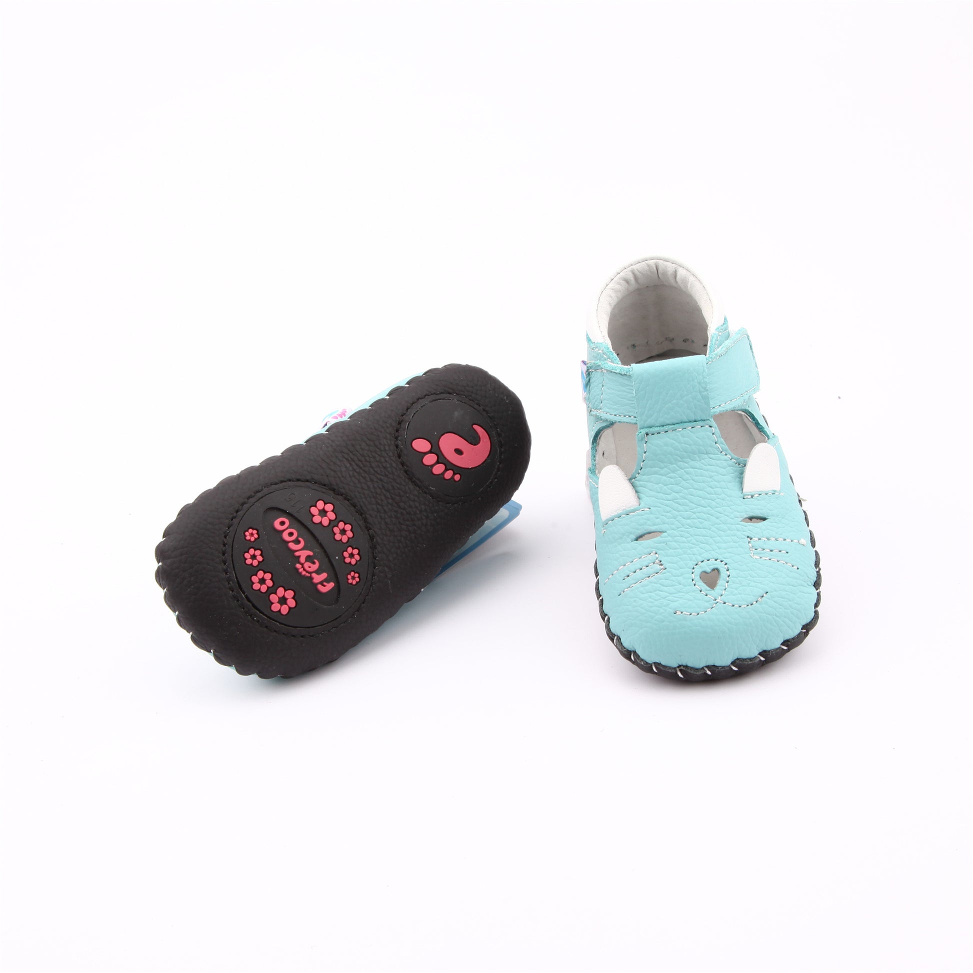 charming light blue leather baby shoes, highlighting their supple material, the protective closed toe, and the detailed dark blue stitching that secures the sole