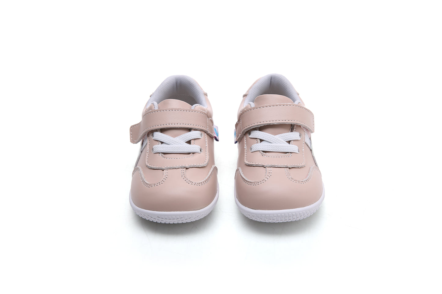 light pink toddler sneakers with white laces, single velcro strap, and flexible white sole