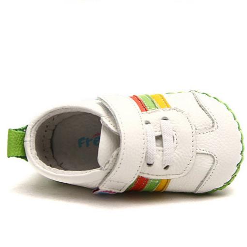 toddler shoe with rainbow stripe detail and lime green heel tab side angle