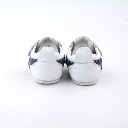 white kids sneakers and velcro straps