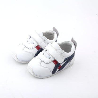 white kids sneakers made from genuine soft leather with blue and red side stripes and velcro